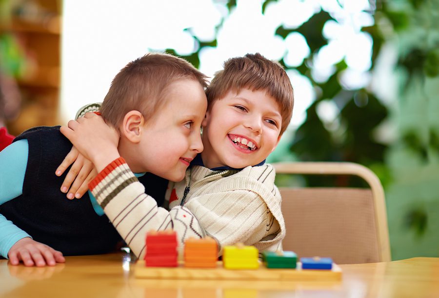 happy kids with cerebral disabilities in preschool